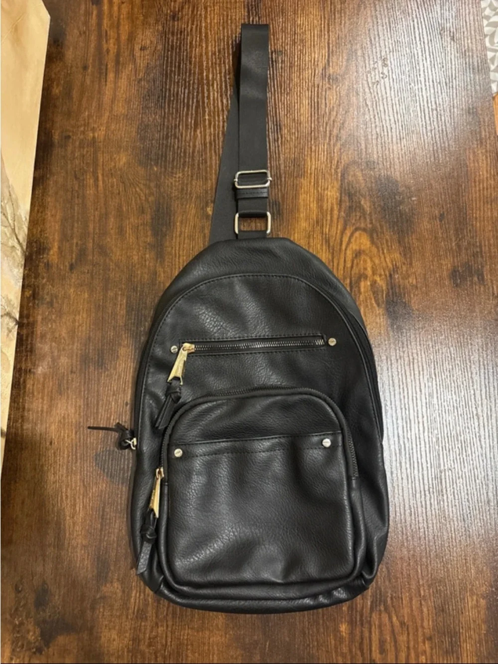 Dolce Vita Black Leather Sling Backpack with Gold Hardware